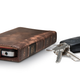 Illustration for article titled BookBook Case Makes Your iPhone 4 Smell of Rich Mahogany